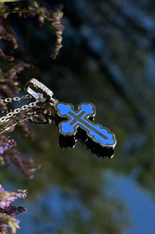 A handmade Orthodox cross of the Gloria series in small size.18K white gold and coloured enamel, pendant is decorated with four diamonds. 