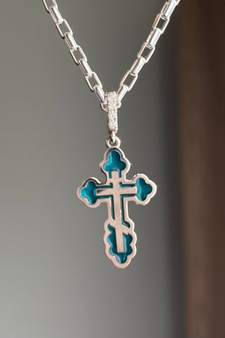 An elegant orthodox cross Margaret. 18K white gold, decorated with coloured transparent enamel and diamonds. VARVARA collection. Stained glass technique.