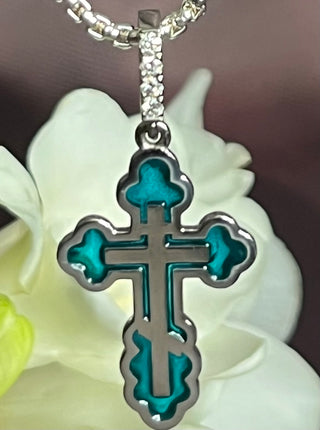 An elegant orthodox cross Margaret. 18K white gold, decorated with coloured transparent enamel and diamonds. VARVARA collection. Stained glass technique.