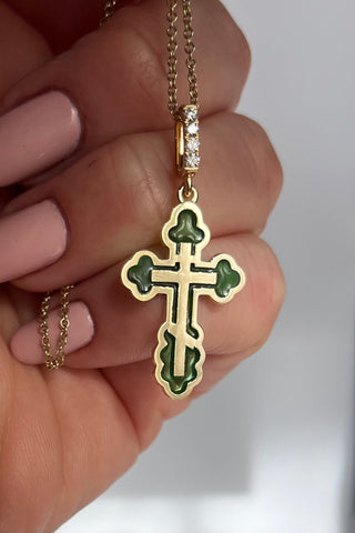 An elegant orthodox cross of the Margaret series with a classic shape is made of 18 carat yellow gold, decorated with coloured transparent enamel and diamonds. VARVARA collection.