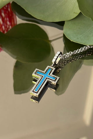 A  jewellery Catholic cross of the Petite Harmony , white 18K gold,  enamel,  diamonds.  VARVARA collection brand. 18K white gold, coloured enamel, 74 round cut diamonds FG\VS1 Weight of gold 5.78g Diamonds, carat total weight 0.4ct varvara-collection.com